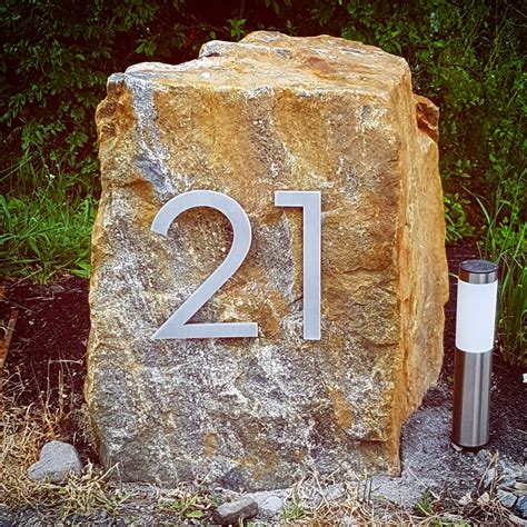 large rocks with house numbers